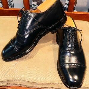 Allen Edmonds Byron Black Cap Toe Oxfords.